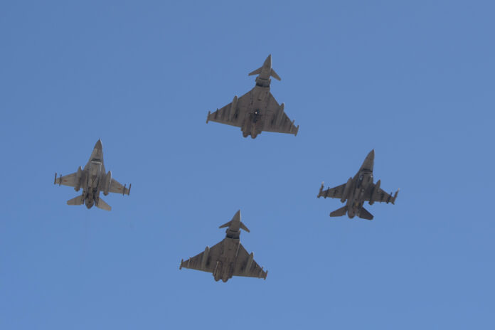 F-16_and_Eurofighter_Typhoon_flying_in_Formation F 16 And Eurofighter Typhoon Flying In Formation